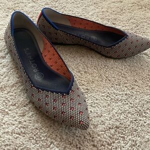 Rothy’s navy orange dot pointed flats, size 7.